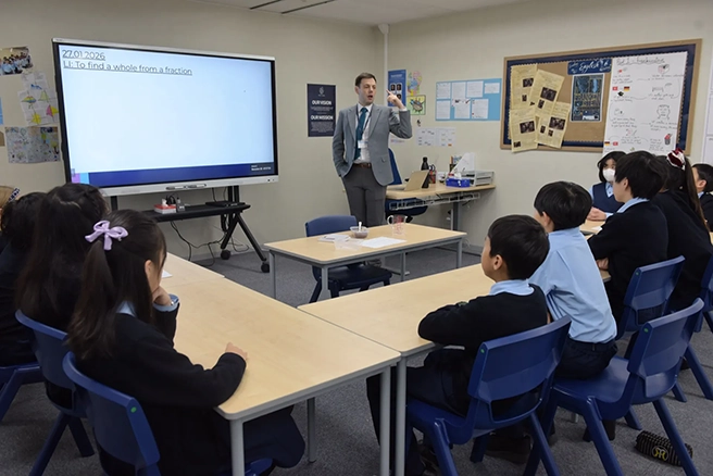 Teacher presenting at NLCS Kobe